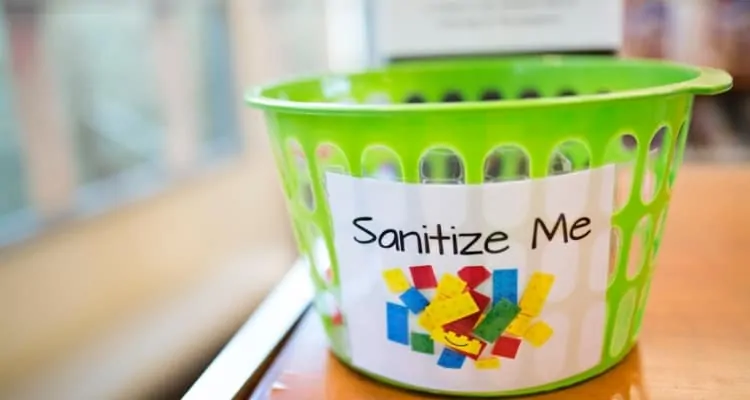bucket with sanitize me written on it