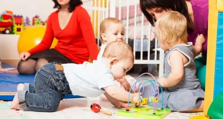 kids playing as adults watch