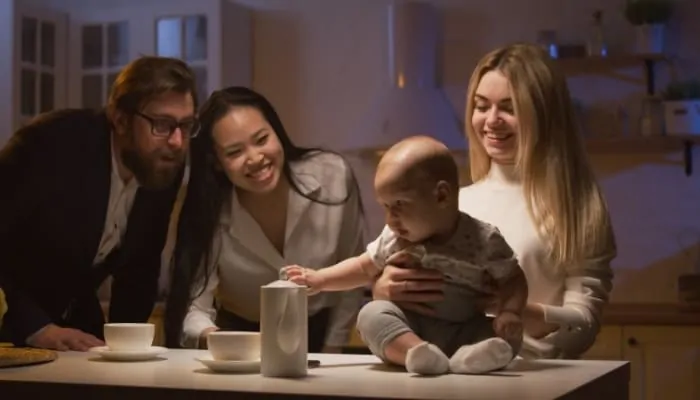 Parents picking up baby from a babysitter