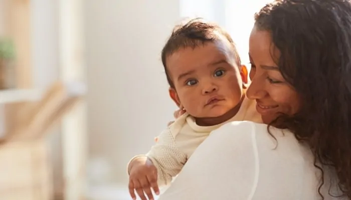 a mom holding a baby