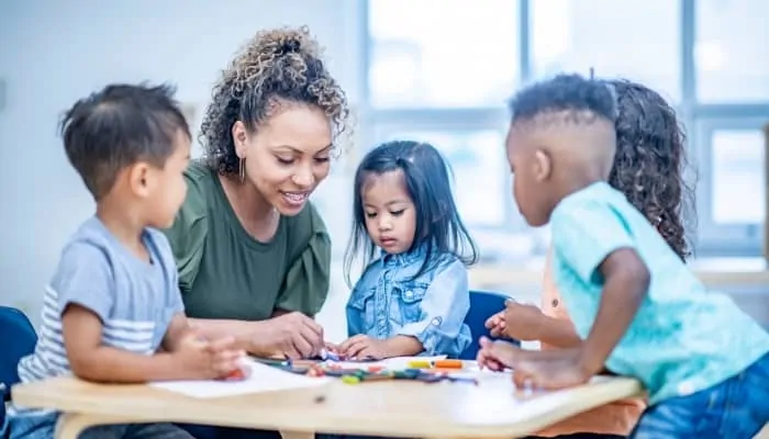 a daycare teacher playing with kids