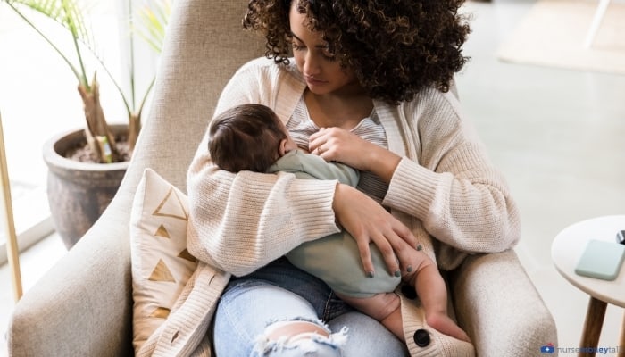 a mom breastfeeding a new baby