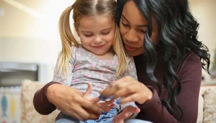 a nanny playing with a child