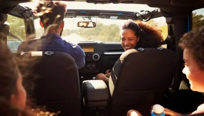 family in car for roadtrip