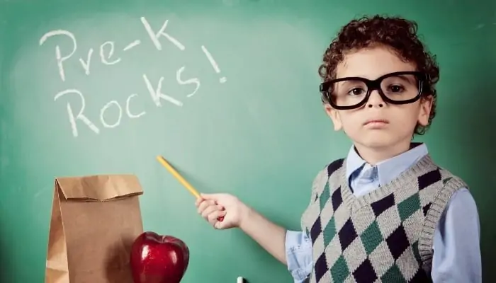 boy in front of chalk board