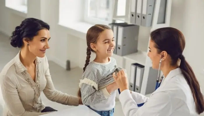 mom with child at pediatrician