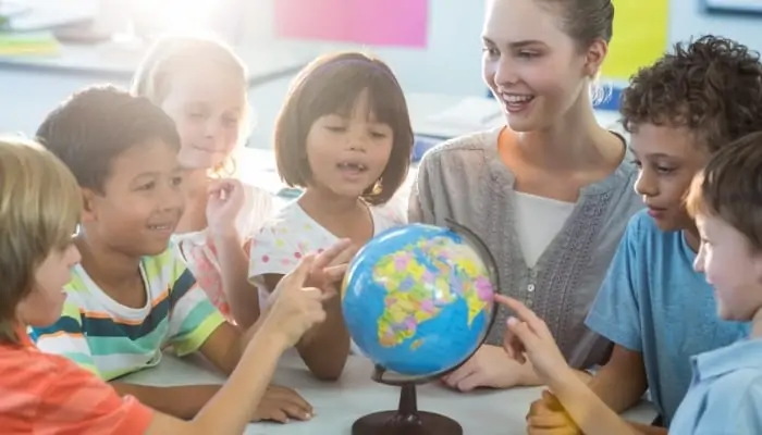 teacher and students learning geography