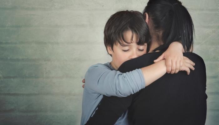a child hugging mom