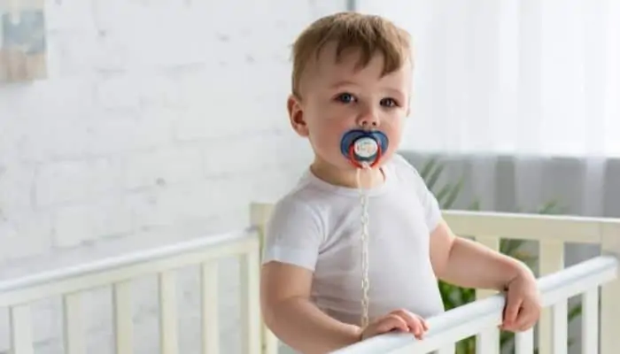 a child with pacifier in their mouth