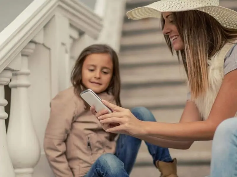 mom and child using phone