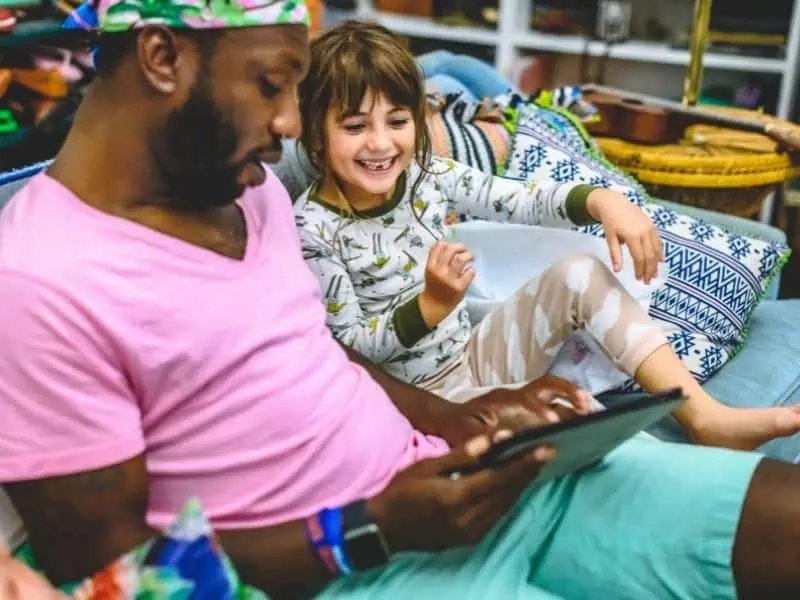 man and stepdaughter playing together