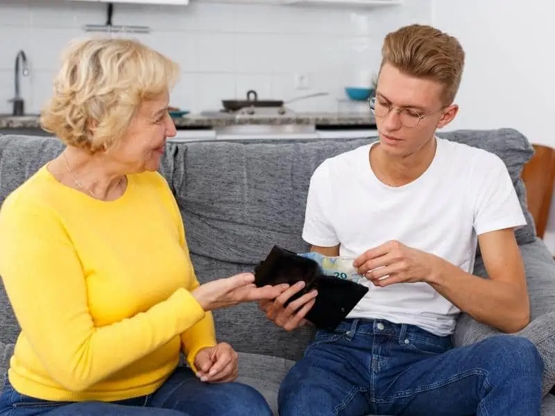 man giving money to mom