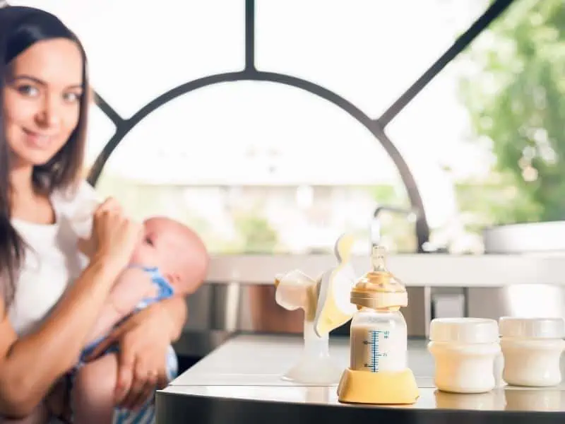 mother and baby with pumping bottle and milk formula