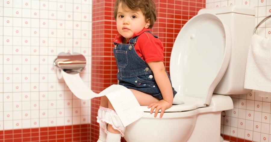 toddler using the potty