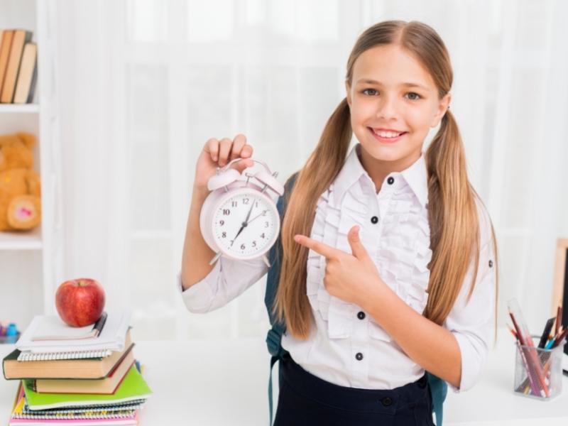 kid with alarm clock