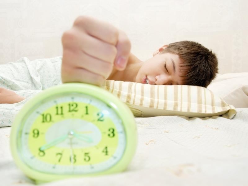 kid with alarm clock