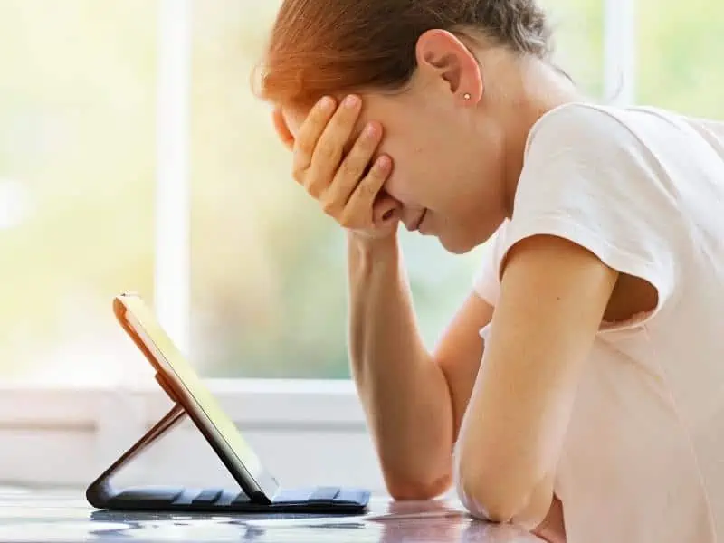 Article image - woman using tablet headache