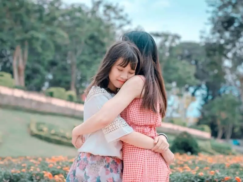 hugging mom and daughter