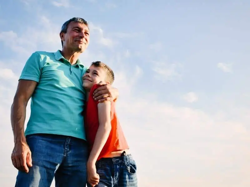 dad and son hugging