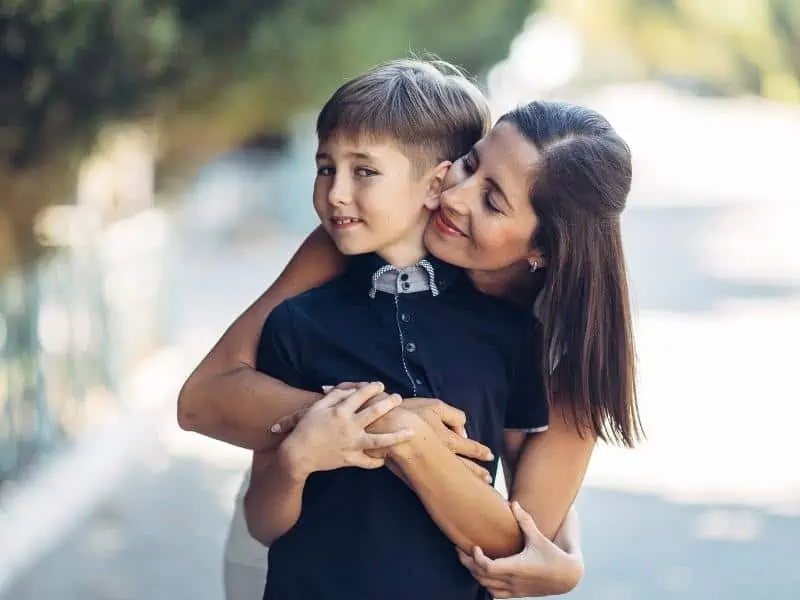 mom hugging son