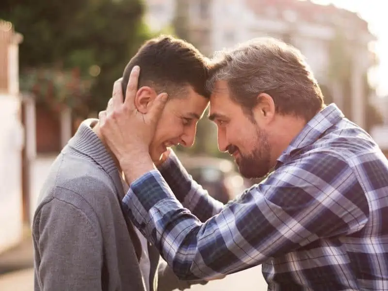 dad holding his son 