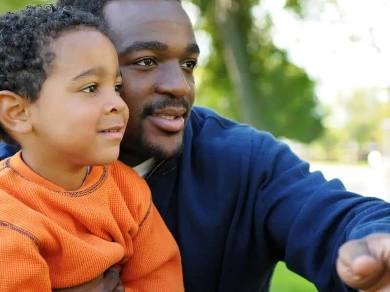 dad and son looking something