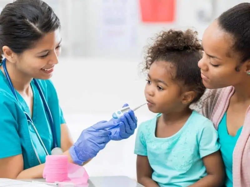 a nurse with a pediatric patient