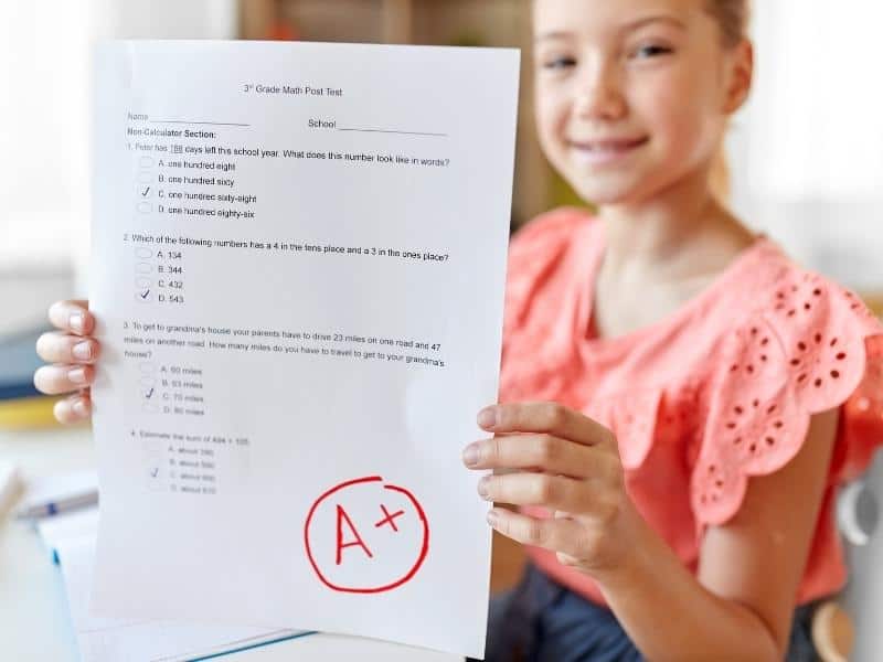 girl holding exam result