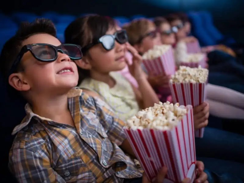 stock image - kids on movies