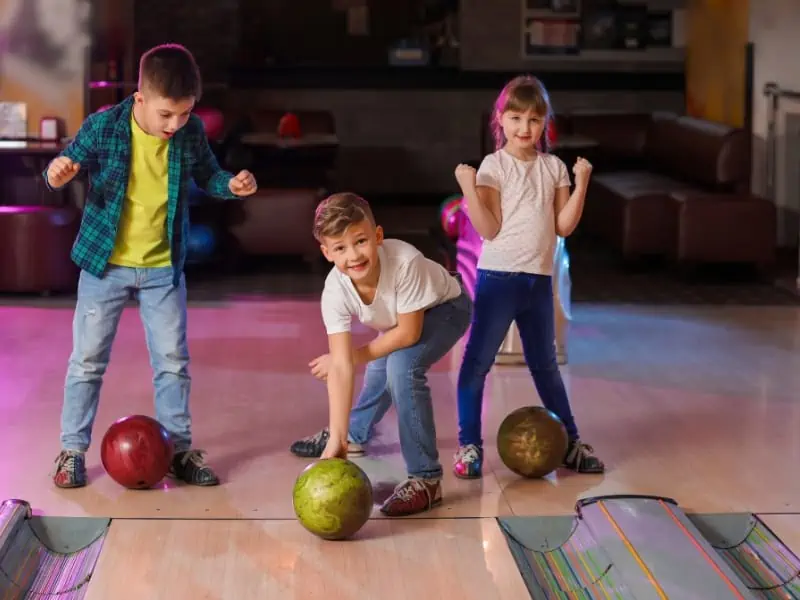 stock image - kids playing bowling