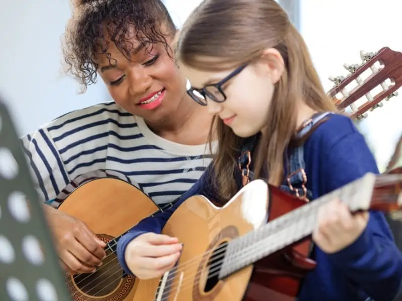 black woman teaching music