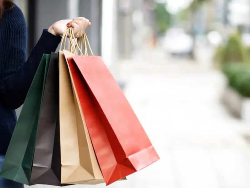 holding shopping bag