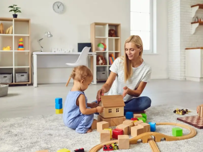 blonde babysitter in white background