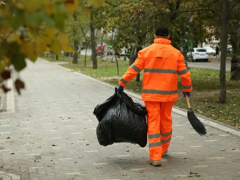 groundskeeper cleaning the streets