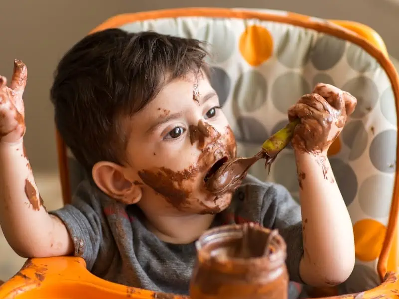 baby eating chocolate