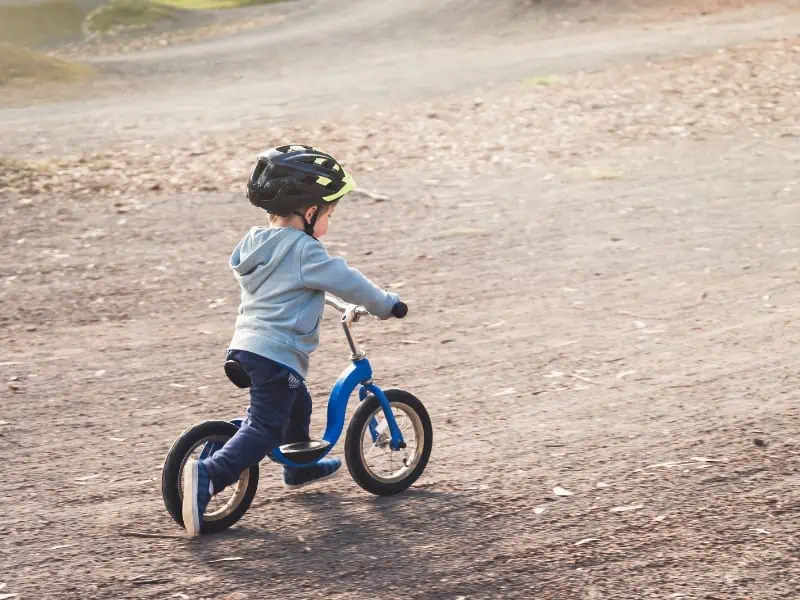 little boy riding bike