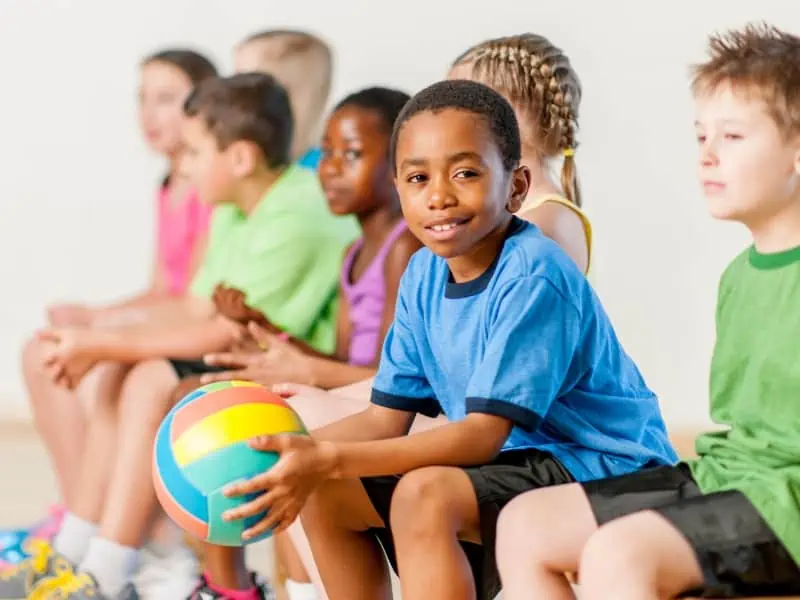 kid holding a ball