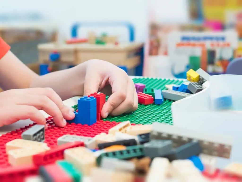 kid playing lego