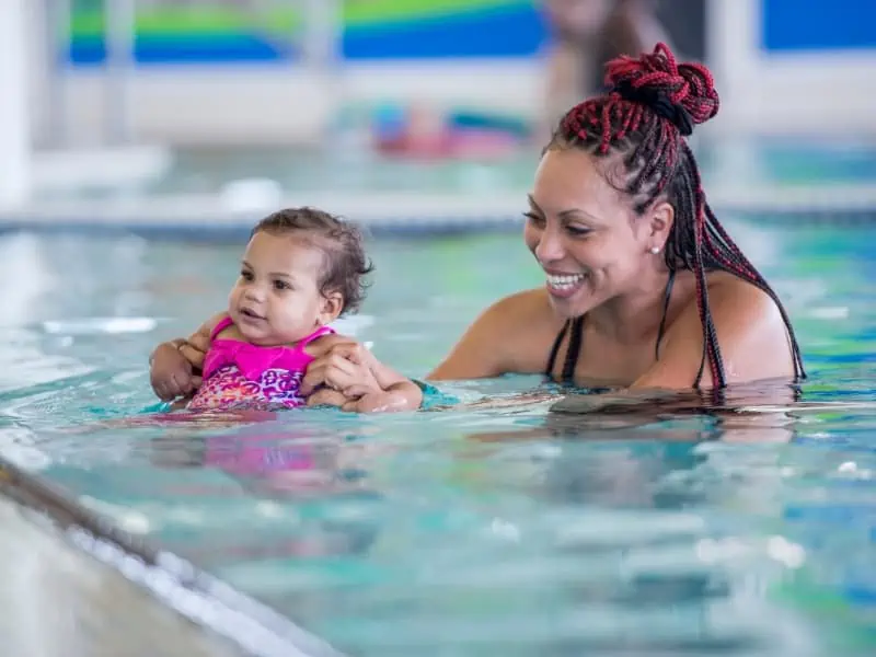 baby learning to swim